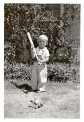 Dave Baldwin trying to swing a bat at age of two.